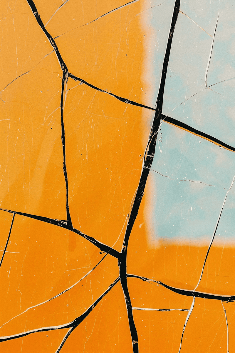 abstract cracked orange and teal textured surface